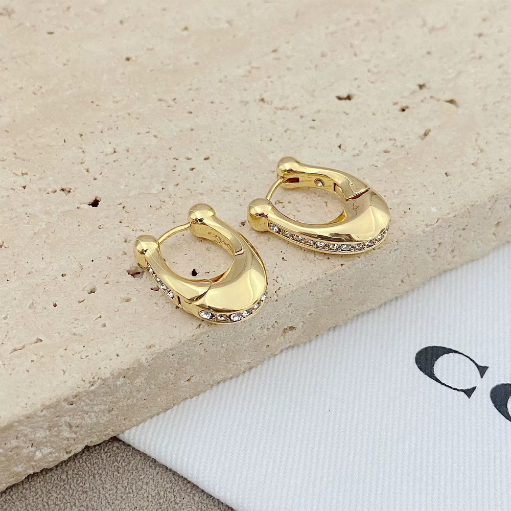 Coach Diamond Inlay Metal Earrings